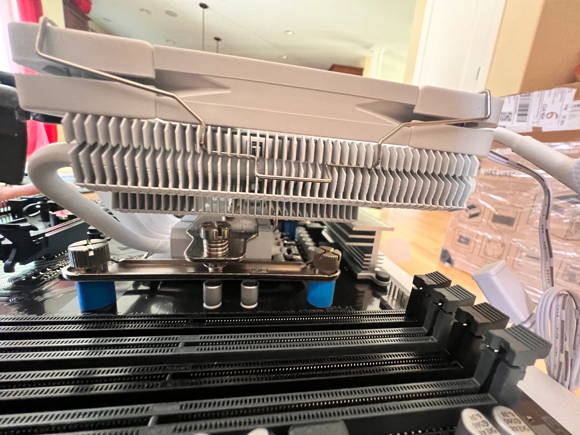 The front tower overhangs the outermost DIMM slot